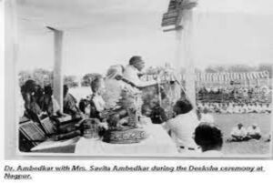 Which religion did Dr. Ambedkar adopt?